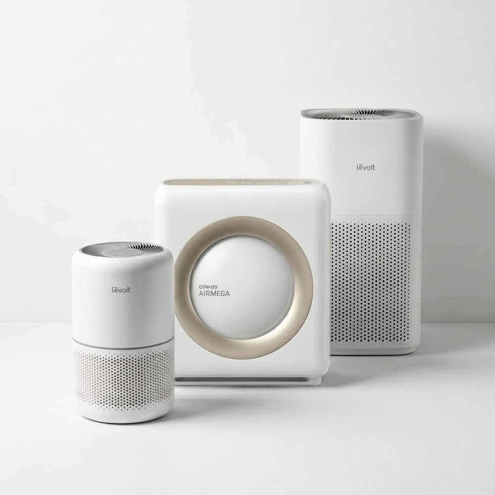Studio group shot of the three recommended air purifiers for different room sizes: the compact Levoit Core 300 (left), the powerful Coway Airmega 1512HH (center), and the large-capacity Levoit Core 600S (right).
