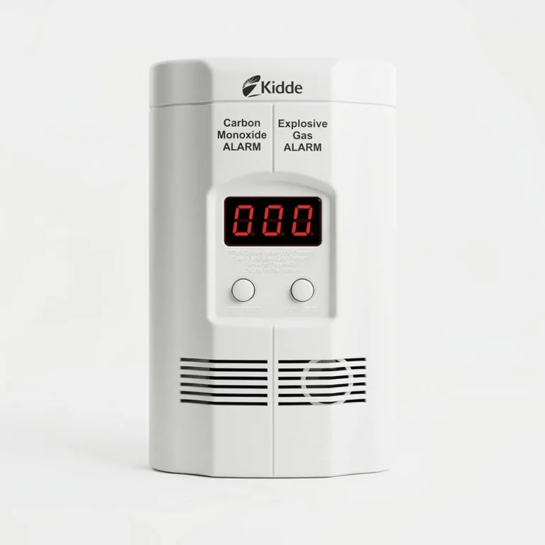 A front view of the Kidde Plug-in Gas and Carbon Monoxide Detector with Battery Backup, showing its white utilitarian housing, integrated 110V power plug, and a digital LED display designed to provide real-time CO and explosive gas alerts.