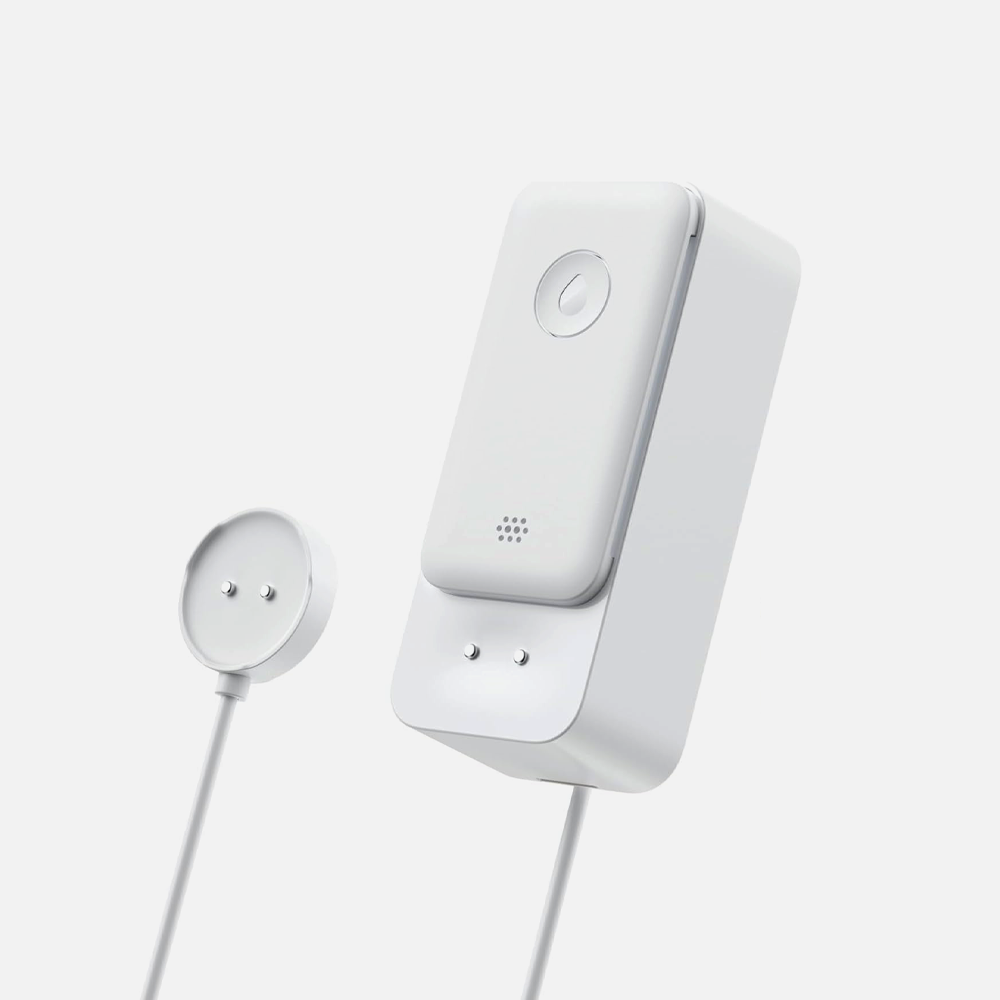 A professional studio shot of a white SwitchBot WiFi water leak detector on a solid white background, showcasing the four highly sensitive metal contact probes on its base.