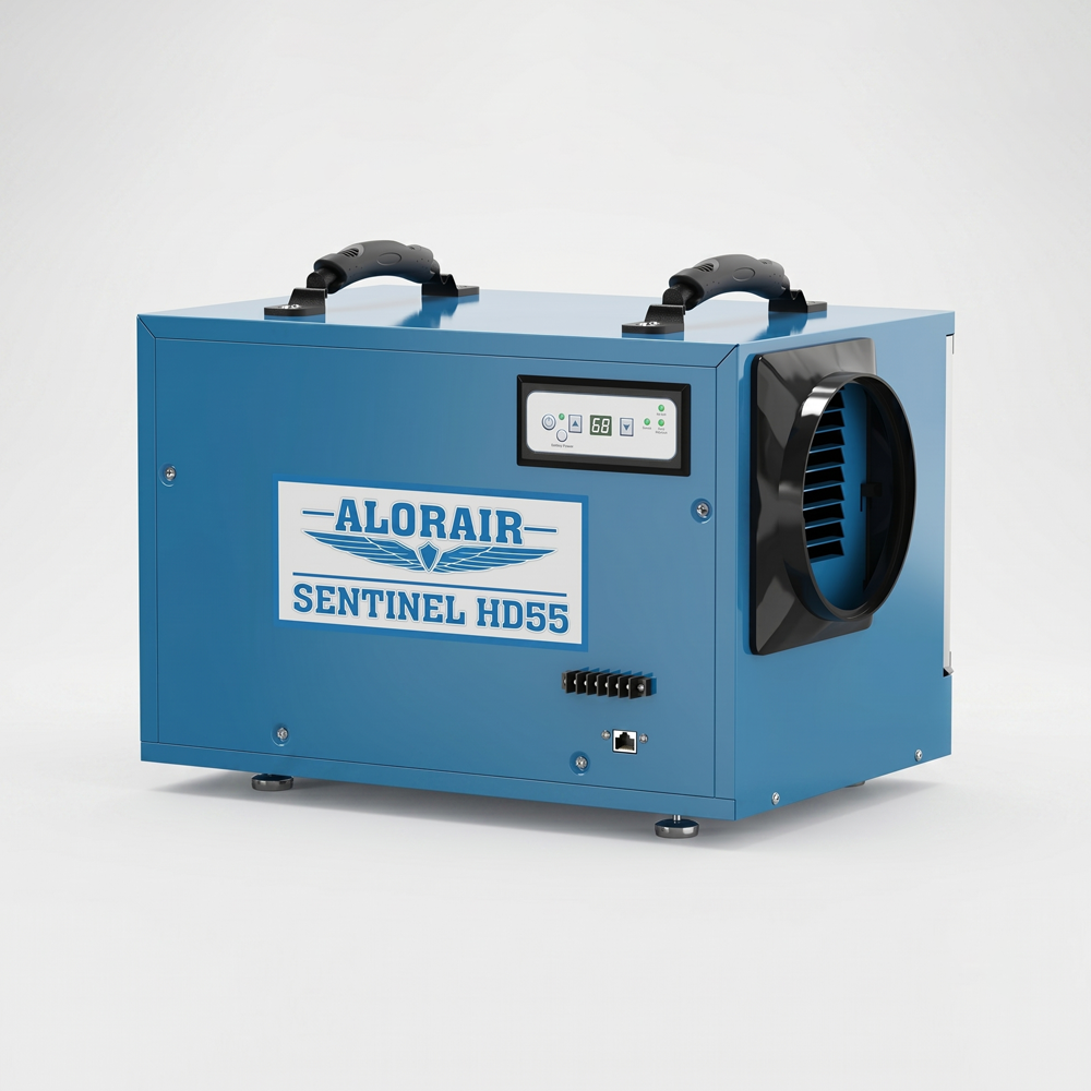 A blue ALORAIR Sentinel HD55 commercial dehumidifier with a rugged box-style design. It features two black carrying handles on top, a digital control panel on the front, and a circular black exhaust duct on the right side.