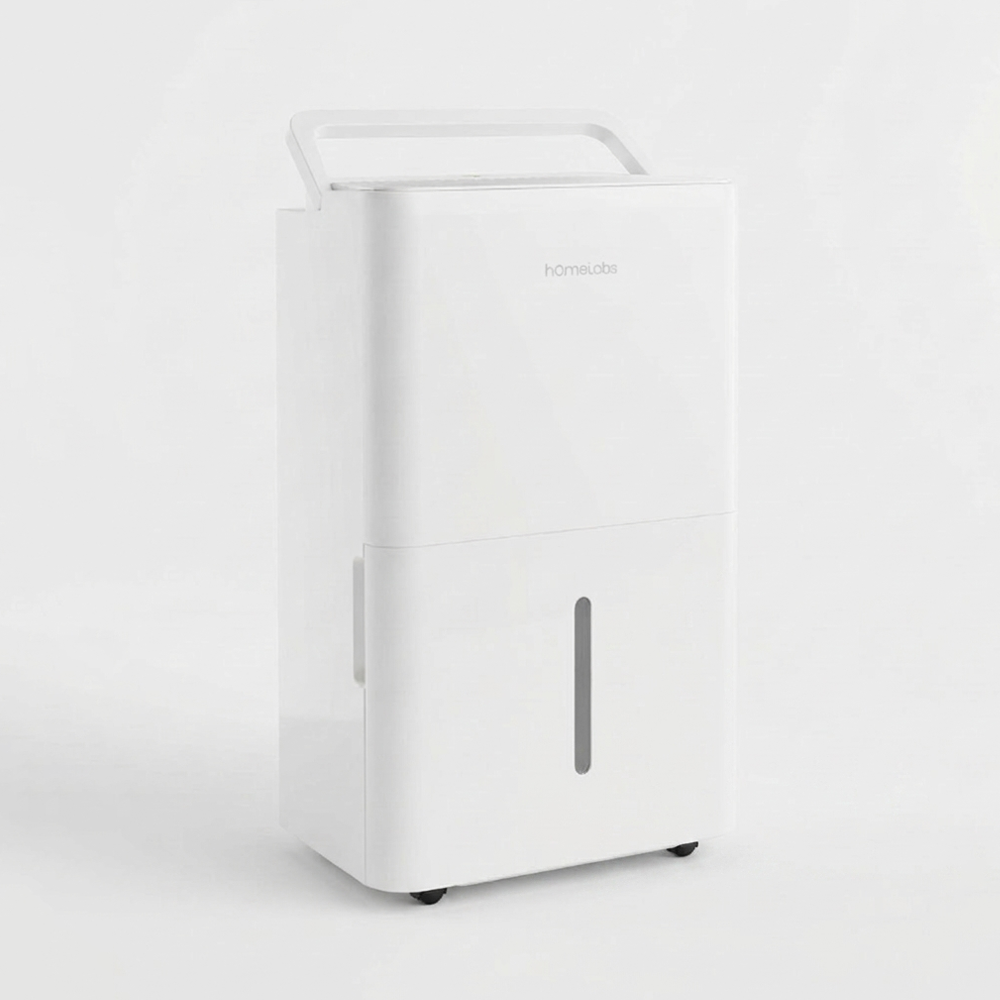 A modern, white hOmeLabs dehumidifier with a sleek design. It features a wide handle integrated into the top and a slim, vertical water level viewing window on the front water bucket.